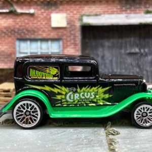 Loose Hot Wheels Ford Model A Sedan Dressed in Black and Green