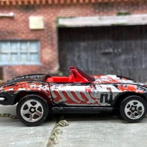 Loose Hot Wheels 1965 Chevy Corvette Dressed in Black Skull and Cross Bones Livery