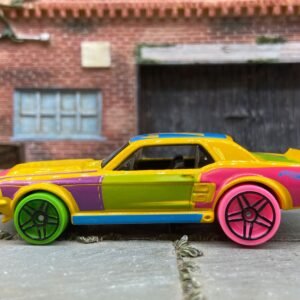 Loose Hot Wheels 1967 Ford Mustang GT Dressed in Yellow, Pink and Blue Art Car Livery