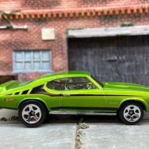 Loose Hot Wheels 1969 Pontiac GTO Dressed in Green and Black