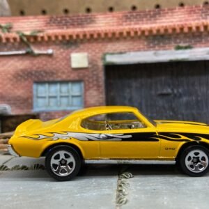 Loose Hot Wheels 1969 Pontiac GTO Dressed in Yellow, Black and Silver with Flames