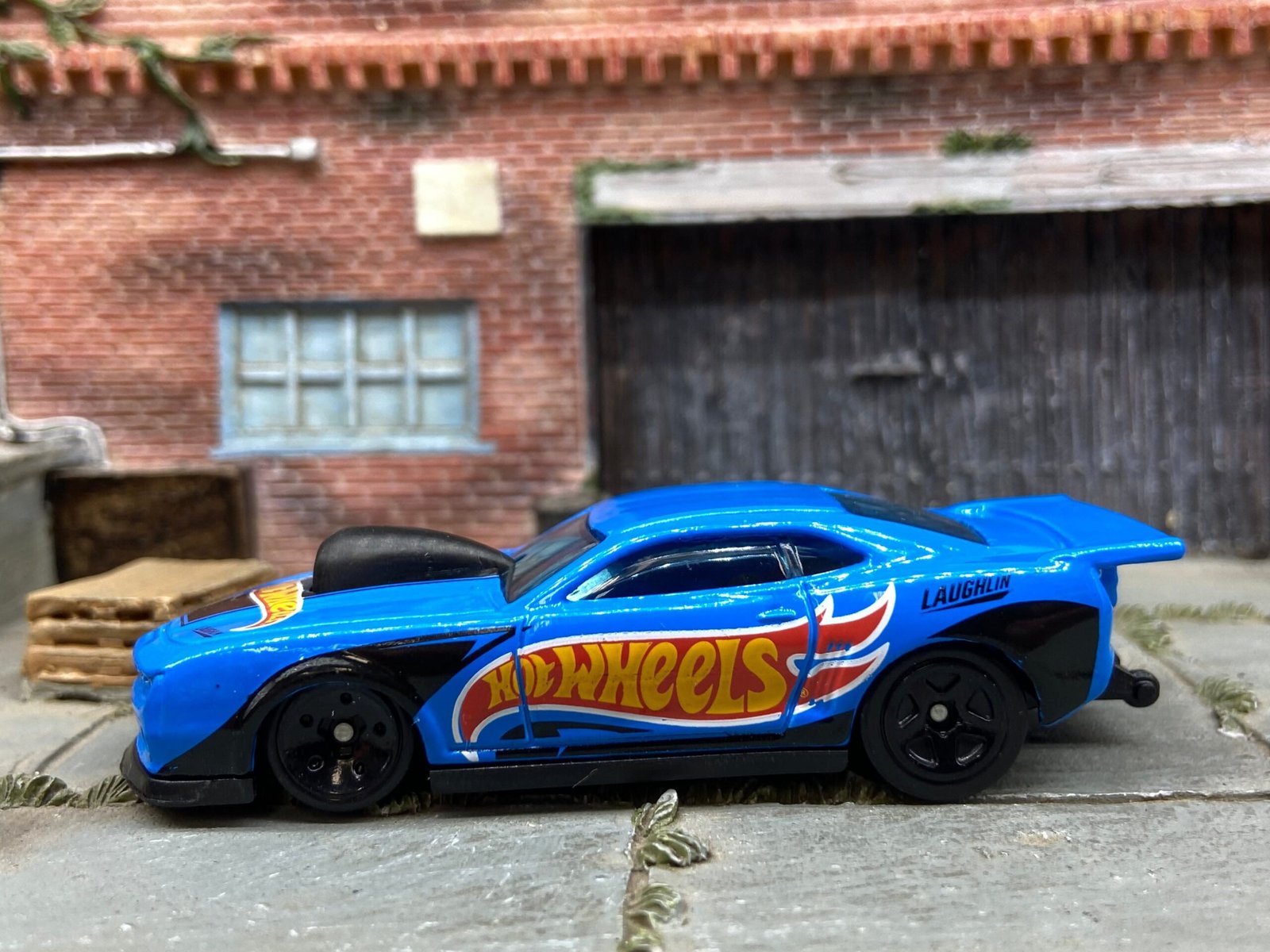 Loose Hot Wheels 2010 Pro-Stock Chevy Camaro Drag Car Dressed in Blue and Black Hot Wheels Livery