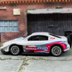 Loose Hot Wheels Pikes Peak Toyota Celica Race Car - White, Pink and Blue SweetTarts
