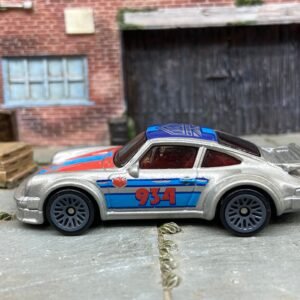 Loose Hot Wheels Porsche 934 Turbo RSR Dressed in Silver, Blue and Red Urban Outlaw Livery