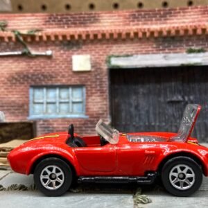 Loose Hot Wheels Shelby Cobra 427 S/C Dressed in Red With Yellow
