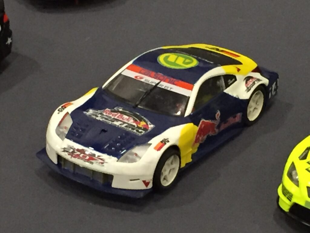 Real photo of a NASCAR Red Bull diecast race car at a diecast convention